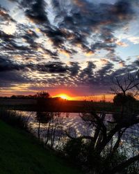 Scenic view of sunset over lake