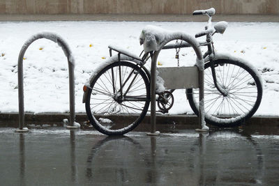 Bicycle  covered with snow on the street