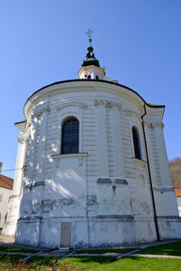 Low angle view of building against clear blue sky