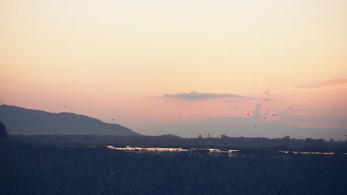 Scenic view of silhouette landscape against sky during sunset