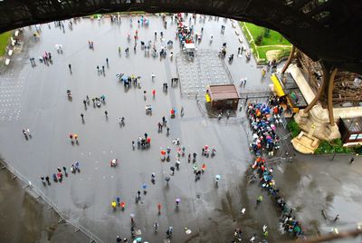 High angle view of people below eiffel tower