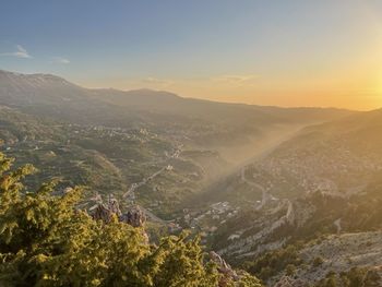 High angle view of mountains against sky during sunset