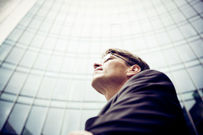 Low angle view of man looking up