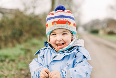 Portrait of cute boy in park during winter