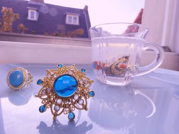 Jewelry in cup with cleaning solution