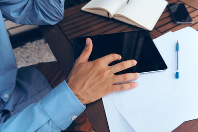 Midsection of man working at office