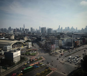 High angle view of city buildings against sky