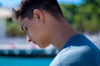 Close-up portrait of young man looking away