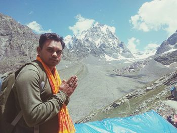 Man on mountain against sky