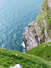 High angle view of rocks by sea