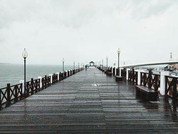 Pier over sea against sky