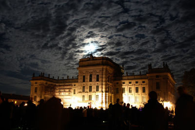 Low angle view of illuminated building at night