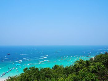 Scenic view of sea against clear blue sky