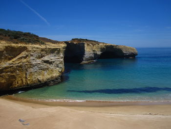 Scenic view of sea against blue sky