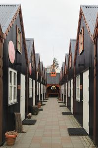 Alley amidst buildings against sky