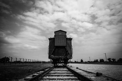 Train on railroad track against sky