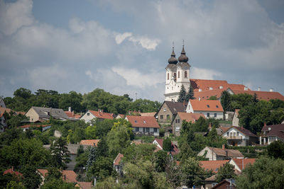 Houses in town against sky