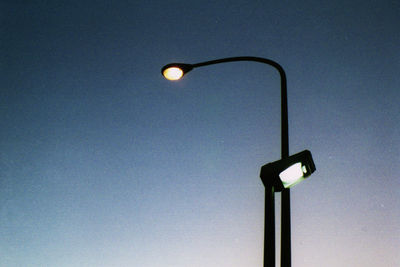 Low angle view of illuminated street light