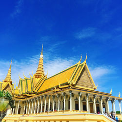 Low angle view of temple building against blue sky