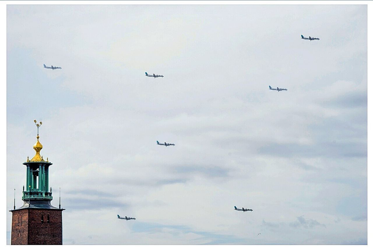 LOW ANGLE VIEW OF AIRPLANE FLYING AGAINST SKY