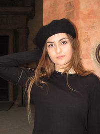 Portrait of young woman in hat