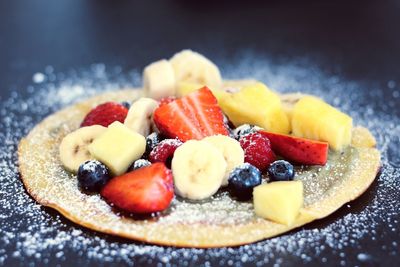 Close-up of fruits on cake