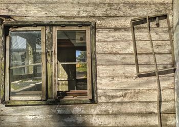 Broken glass window of old abandoned building