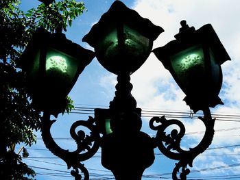 Low angle view of street light against sky