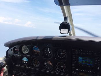 Close-up of dashboard against the sky