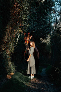 Woman standing in forest