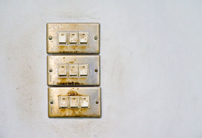 Close-up of telephone booth on wall