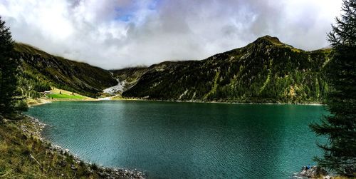 Scenic view of lake and mountains against sky