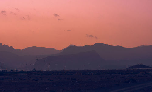 Scenic view of silhouette landscape against sky during sunset