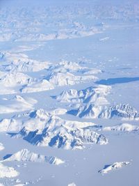 Aerial view of snow covered mountains