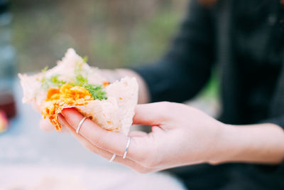 Close-up midsection of man holding food