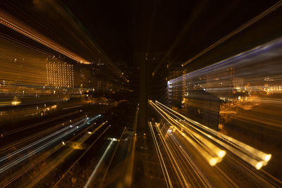 High angle view of light trails on road at night