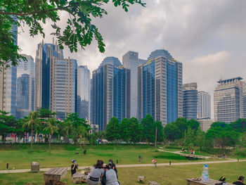 Panoramic view of buildings in city against sky