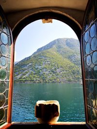 View of lake seen through window