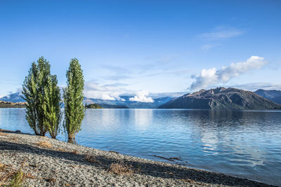 Scenic view of lake against blue sky