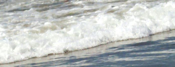 Waves splashing on shore