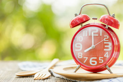 Close-up of clock on table