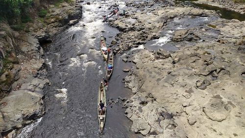 High angle view of people on rock