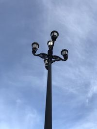 Low angle view of street light against sky