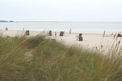 Scenic view of beach against clear sky