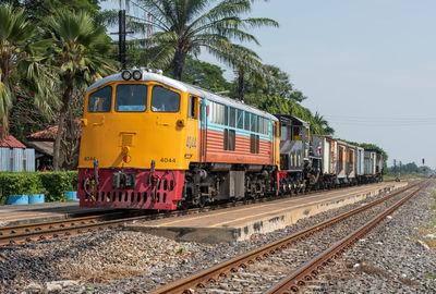 Train on railroad track against sky