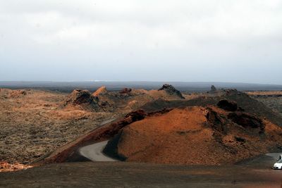 Scenic view of volcanic landscape against sky