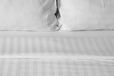 High angle view of blanket and pillows on bed