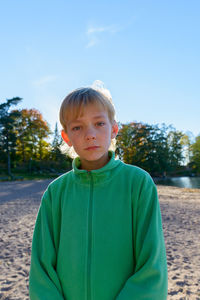 Portrait of boy against sky