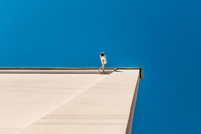 Low angle view of building against clear blue sky