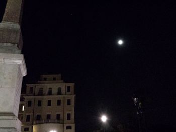 Low angle view of illuminated buildings at night